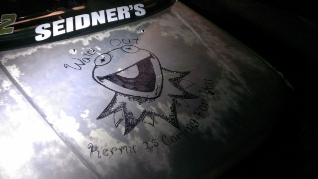 Alex doing some decorating on our unpainted hood